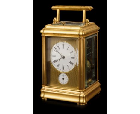 * Carriage clock. A later 19th century striking and repeating alarm clock, with carrying handle and repeat button, the white 