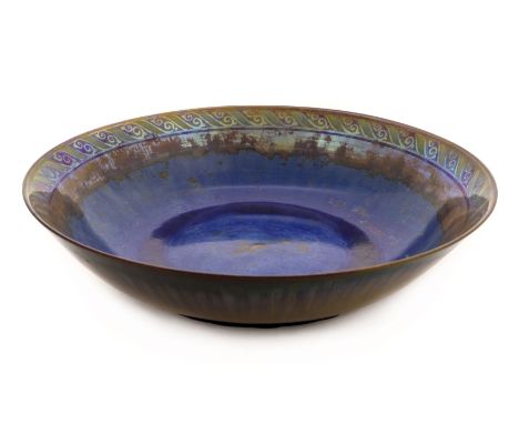 * Pilkington. A Royal Lancastrian pottery bowl by William Mycock 1926, the circular lustre bowl with a blue ground and green 