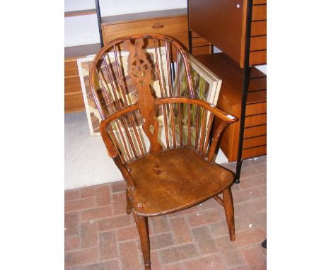 A 19th century country stick-back arm chair