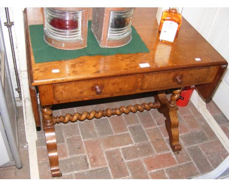 A sofa table with barley twist stretcher