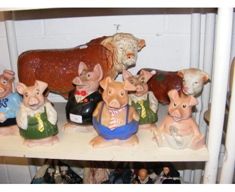 A collection of six Wade NatWest Piggy Banks, together with Melba Ware Highland Cattle 