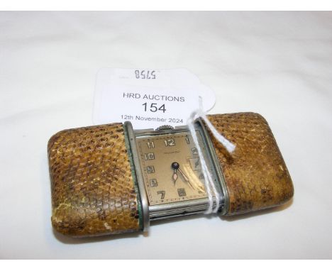 A Movado snakeskin style vintage travelling clock