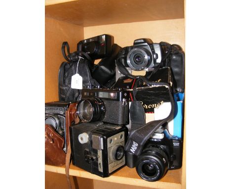 Assorted vintage cameras and photographic equipment, including Rolleiflex, Yashica Electro 35, Coronet Ambassador and Minolta