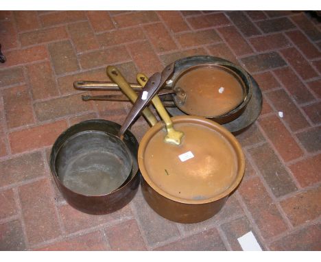 An antique copper skillet, saucepans etc.