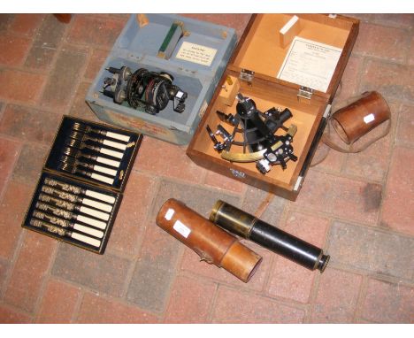 A sextant in box, a telescope in leather case, cased cutlery set, etc. 