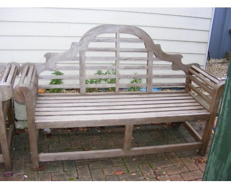 A slatted wooden garden bench with rolled armrests - width 165cm 