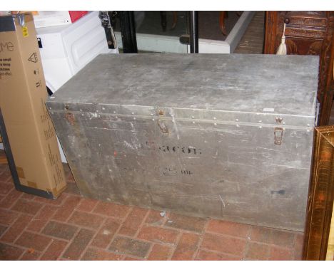 A galvanized metal trunk/flight case bearing 'Albacom' name 