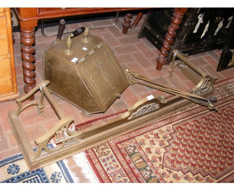 An antique coal scuttle, fire fender with tools