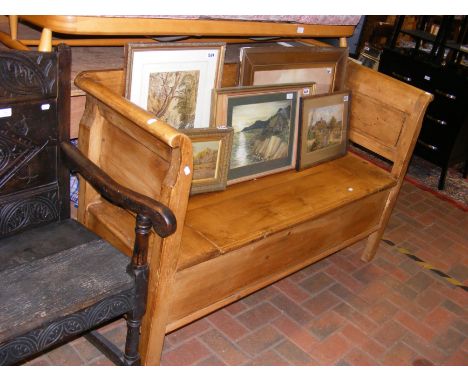 A pine bench with lift-up seat - width 152cm 
