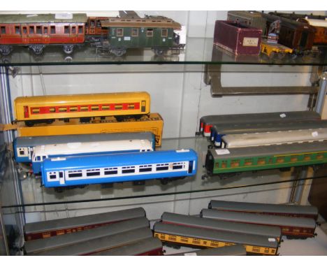 A shelf of plastic Lima 0 gauge carriages - 1 boxed