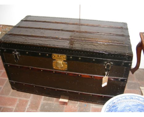 A 19th century Goyard of Paris travelling trunk with wooden studded surround and engraved brass lock - purchased by the vendo