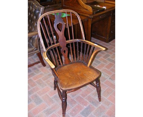 A 19th century country stick-back arm chair