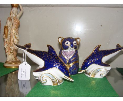 A Royal Crown Derby koala bear paperweight together with two dolphins