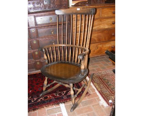 A stick back rocking chair