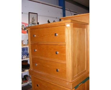 A contemporary light oak three drawer chest with square metal handles - width 84cm 