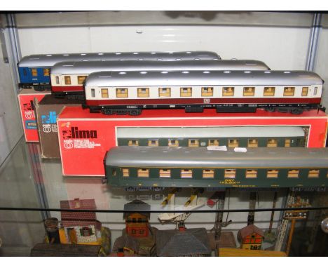 Three boxed Lima 0 gauge carriages together with four unboxed 0 gauge carriages