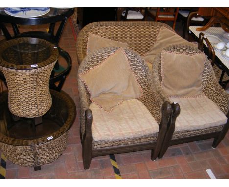 A conservatory suite comprising a two seater sofa, two armchairs, a circular coffee table and a side table - featuring carved