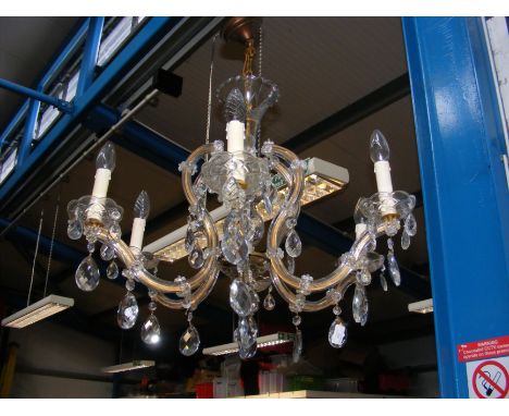 A six branch electric candelabra ceiling light with cut glass droplets 
