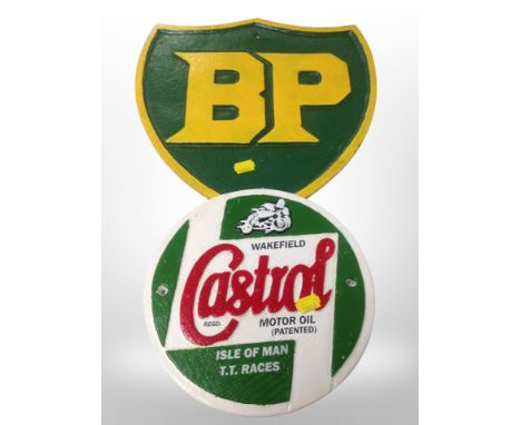 A cast iron BP sign, similar Castrol sign and a large Ford oval panel, width 160 cm