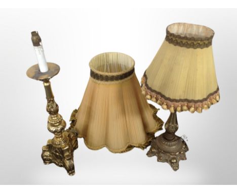 An ornate brass table lamp with tasseled shade and further gilt gesso lamp 