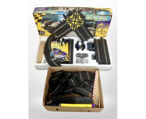 A boxed Scalextric Le Mans 24 racing set and a further box of track etc 