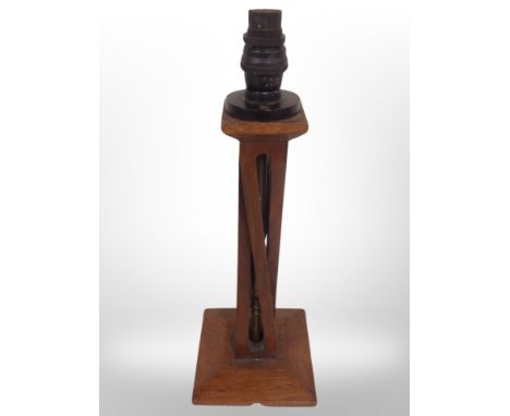An Arts and Crafts oak lamp base, height 40 cm 