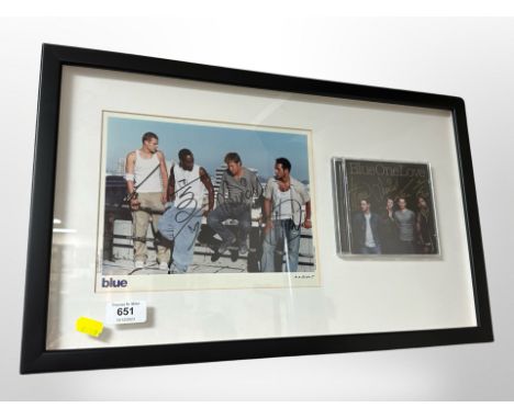 A Blue One Love CD and accompanying photograph, each signed by the band, framed, 54 cm x 33 cm