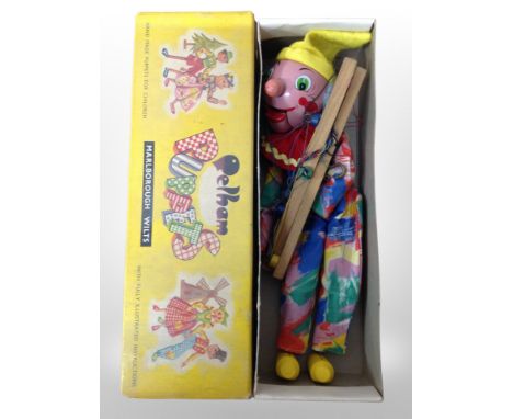 A Pelham puppet in box