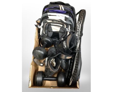 A box of roller blades, badminton rackets, dumbells, two rucksacks 