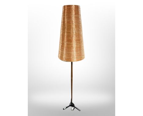 A 1970's teak and cast iron standard lamp with copper-coloured conical shade, height 170 cm