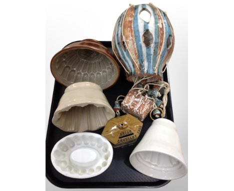 Four ceramic jelly moulds together with money box and hanging hot air balloon ornament 