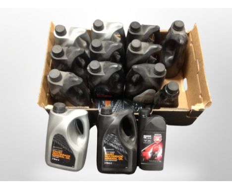 A box of several bottles of multi  grade mineral oil for diesel engines, Honda engine oil etc 
