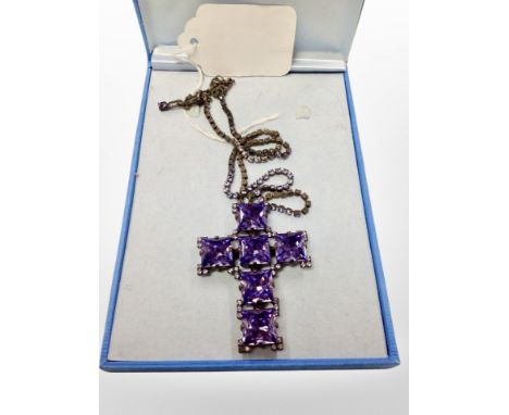 A 1980's Butler and Wilson Crystal crucifix pendant on similar chain CONDITION REPORT: 6 cm x 4.5 cm pendant 