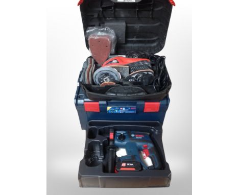 A Bosch hammer drill in case and a Black and Decker sander 