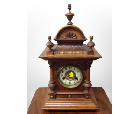 A late Victorian walnut eight day mantle clock, height 45 cm 