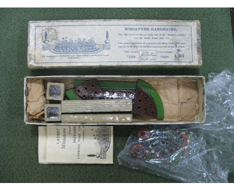 A Pre-War Lead Britains Miniature Gardening Set No. 4MG, overall good with leaflet. Boxed