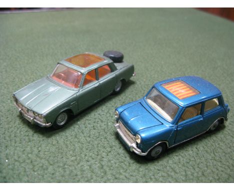 Two Original Corgi Diecast Vehicles, a Golden Jacks Rover 2000TC and a blue mini with sun roof. Both good plus.