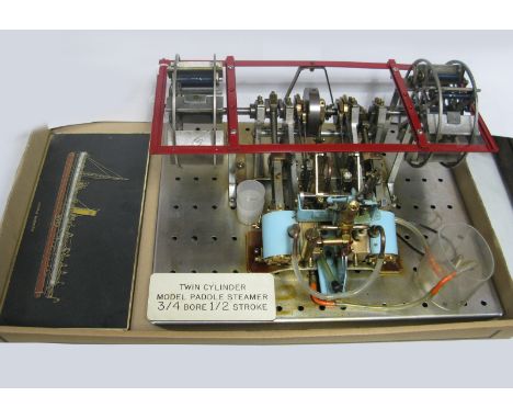 An Engineered Live Steam Model of an Unusual Twin Cylinder Paddle Steamer Engine, with dummy paddles, presented on a display 