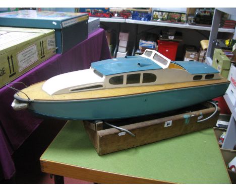 A Mid XX Century Petrol Driven Model Boat In The Form of a Cabin Cruiser, fitted with petrol engine, ideal for a project rest