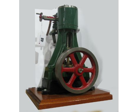 A Stuart No. 4 Vertical Steam Engine, with balanced disk flywheel, built and finished to a good standard, on wooden plinth, 1