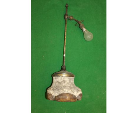 A circa 1900 Rhino foot mounted adjustable table lamp