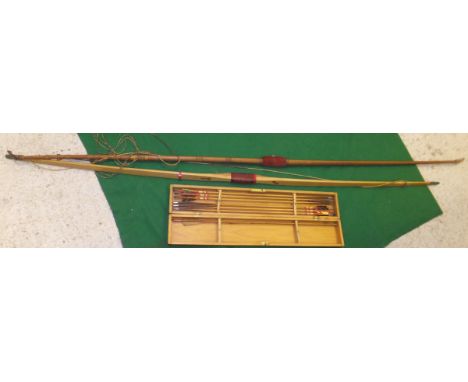 A vintage longbow (spliced), together with a further Slazenger longbow and a boxed box of arrows stamped "Muir Prize Arrows" 