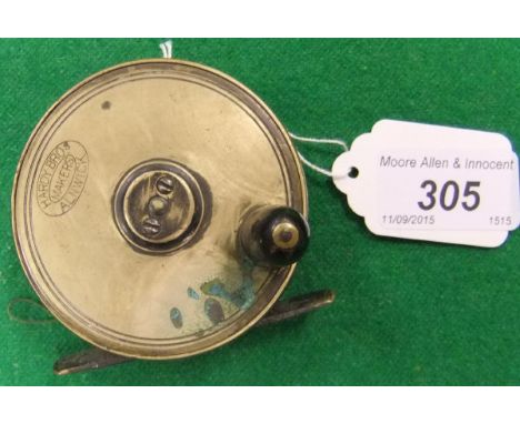 A Hardy 2¾" diameter plate wind fishing reel, bearing oval Hardy logo and rod in hand trademark CONDITION REPORTS Is in used 