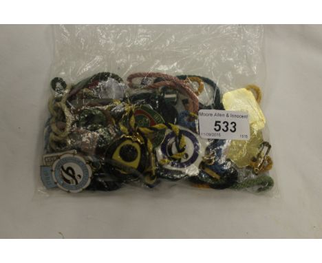 A collection of 28 various enamel race badges