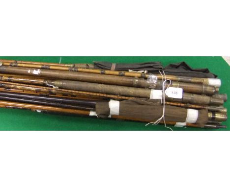 A collection of vintage fishing rods including examples in greenheart, whole cane and split cane
