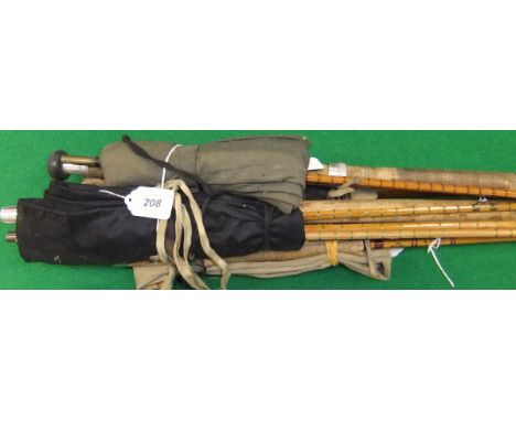 A collection of four vintage fishing rods to include a Sealey "General Practitioner" three piece trout fly rod, a three piece