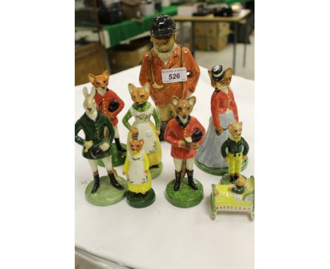 A collection of eight Grey's Fox Family figures by Peggy Alexander, to include baby, together with a pottery figure of a hunt