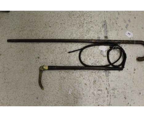 A plaited leather walking stick stamped "Swaine & Adeney", together with a gents hunting whip with plaited leather shaft and 