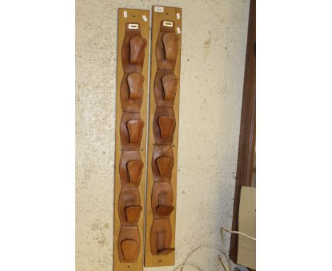 A leather covered six tier two section whip, rod or gun rack   