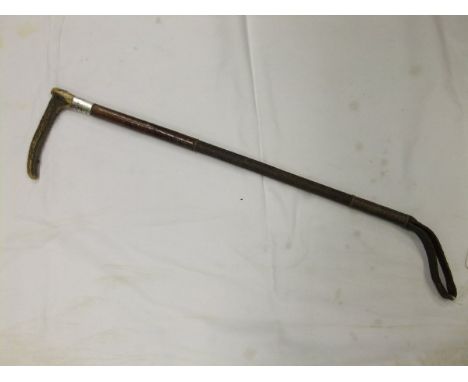 A gents riding crop with leather and plaited string shaft and silver ferrule initialled "GH 1903", bears silver button stampe